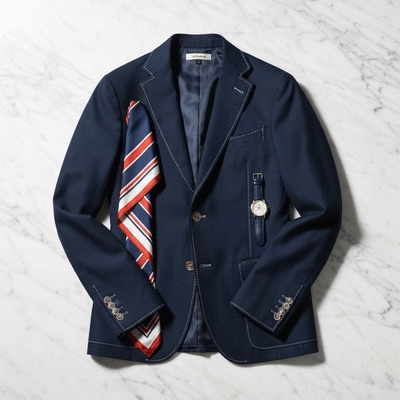 Close up of stylish accessories and a tailored blazer suitable for a French bistro