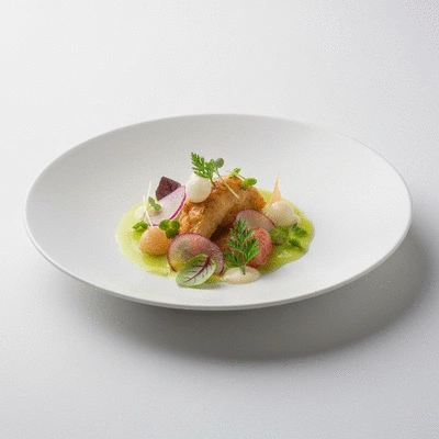 Gourmet French dish with artistic presentation on a white plate