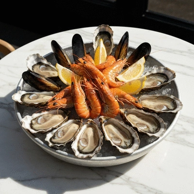 Gourmet French seafood platter with oysters and lemon